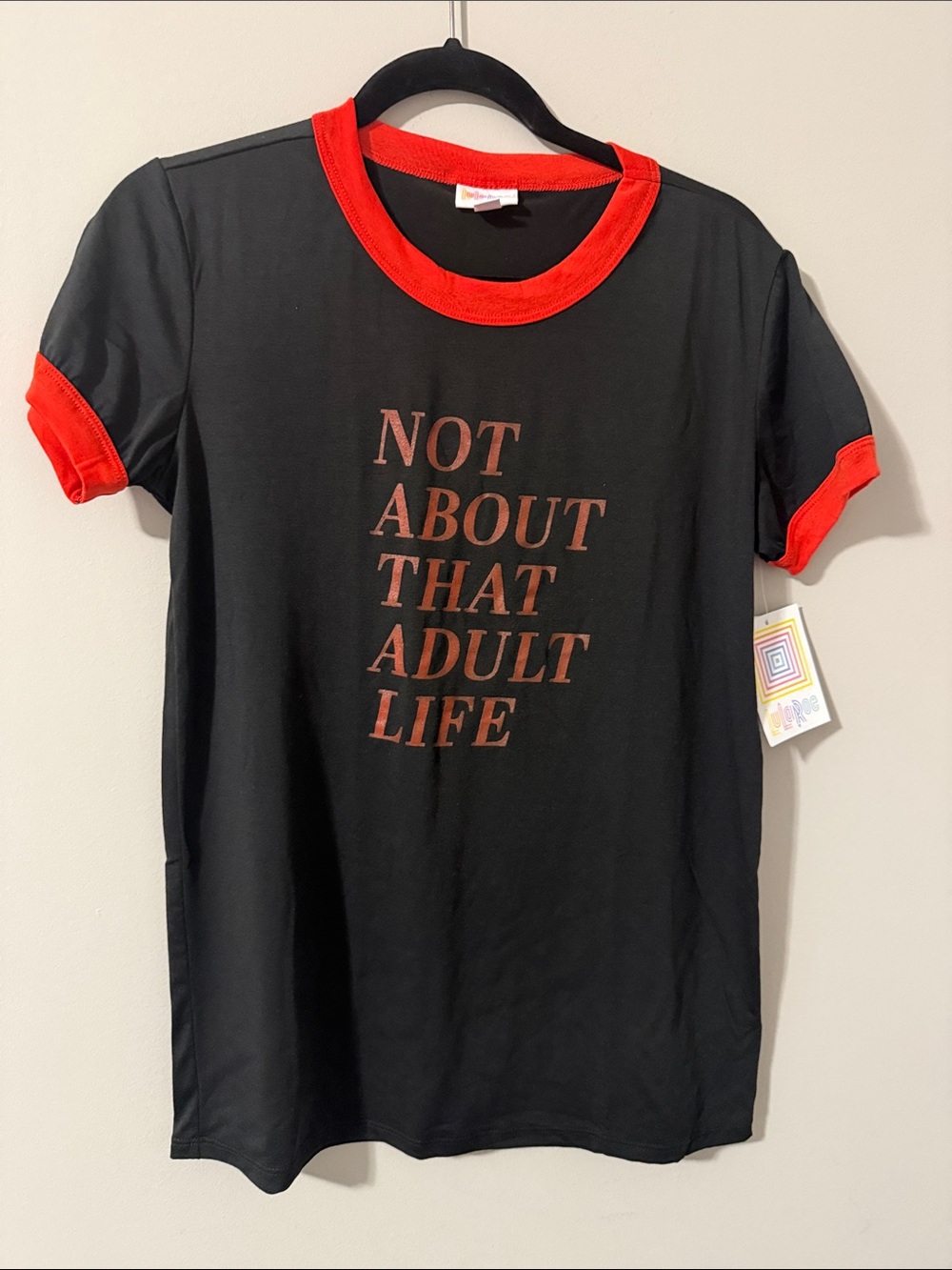 LuLaRoe Black Tee with Red Trim and Slogan